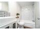 Bathroom with modern vanity, stylish backsplash, marble-look tub/shower, and sleek fixtures at 3416 Polkville Rd, Shelby, NC 28150