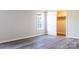 Light-filled bedroom featuring neutral walls, wood-look floors, and a closet at 3416 Polkville Rd, Shelby, NC 28150