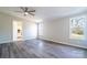 Spacious bedroom featuring gray vinyl floors, neutral walls, a ceiling fan and ample natural light at 3416 Polkville Rd, Shelby, NC 28150