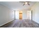 Spacious bedroom boasts neutral walls, wood-look floors, and a ceiling fan with a closet at 3416 Polkville Rd, Shelby, NC 28150