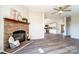 Open living room with a beautiful brick fireplace and view into the updated kitchen at 3416 Polkville Rd, Shelby, NC 28150