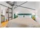 Main bedroom with green accent wall and barn door at 3572 Artists Way, Charlotte, NC 28205