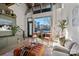 Living area with high ceilings, exposed beams, and lots of natural light at 3572 Artists Way, Charlotte, NC 28205