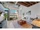 Bright living room with large garage door opening to patio at 3572 Artists Way, Charlotte, NC 28205