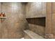 Large walk-in shower with built-in bench and tile surround at 3572 Artists Way, Charlotte, NC 28205