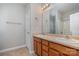 Bathroom with double vanity and wood cabinets at 3649 Warp St, Charlotte, NC 28205