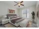 Well-lit bedroom with window and ceiling fan at 3649 Warp St, Charlotte, NC 28205