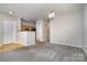 Dining area with carpeted floor and a modern light fixture at 3649 Warp St, Charlotte, NC 28205