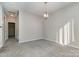 Hallway with carpeted floors and access to stairs at 3649 Warp St, Charlotte, NC 28205