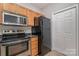 Modern kitchen features stainless steel appliances and light wood cabinets at 3649 Warp St, Charlotte, NC 28205