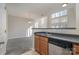 Kitchen with stainless steel dishwasher and light wood cabinets at 3649 Warp St, Charlotte, NC 28205