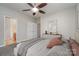 Bright main bedroom featuring an ensuite bathroom and ceiling fan at 3649 Warp St, Charlotte, NC 28205