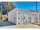 Detached garage with white exterior and double doors at 419 Williamson St, Fort Mill, SC 29715