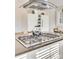 Gas cooktop island with stainless steel range hood at 419 Williamson St, Fort Mill, SC 29715