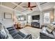 Spacious living room with coffered ceiling,reclining sofas, and large TV at 419 Williamson St, Fort Mill, SC 29715