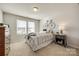 Bedroom with a bed, dresser, and unique wall art at 469 Shallowford Dr, Rock Hill, SC 29732