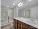 Double vanity bathroom with a large mirror and a walk-in shower at 4829 Boomerang Way, Charlotte, NC 28269