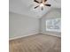 Bedroom with ceiling fan, carpet flooring, and an arched window at 4829 Boomerang Way, Charlotte, NC 28269