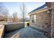 Side view of home showcasing stone exterior and patio area at 4829 Boomerang Way, Charlotte, NC 28269