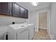 Laundry room with washer, dryer, and additional storage cabinets at 4829 Boomerang Way, Charlotte, NC 28269