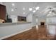 Open living area with hardwood floors, fireplace and kitchen access at 4829 Boomerang Way, Charlotte, NC 28269