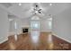 Hardwood floor living room with fireplace, high ceilings and views to kitchen at 4829 Boomerang Way, Charlotte, NC 28269