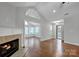 Bright living room with hardwood floors, fireplace and sunroom access at 4829 Boomerang Way, Charlotte, NC 28269