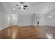 Living room with hardwood floors, vaulted ceilings and access to other rooms at 4829 Boomerang Way, Charlotte, NC 28269