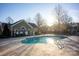 Kidney-shaped community pool with surrounding patio and fencing at 4829 Boomerang Way, Charlotte, NC 28269