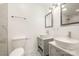 Modern bathroom with double vanity, large mirrors, and tile flooring at 509 Tallwood Ct, Charlotte, NC 28216