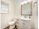 Clean bathroom with single vanity, a toilet, and wood-look flooring at 509 Tallwood Ct, Charlotte, NC 28216