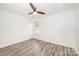 Bright bedroom with hardwood floors and a ceiling fan at 509 Tallwood Ct, Charlotte, NC 28216