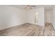 Main bedroom with ceiling fan, en-suite bathroom, and hardwood floors at 509 Tallwood Ct, Charlotte, NC 28216