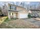 Two-story house with attached garage and stone walkway leading to the front door at 509 Tallwood Ct, Charlotte, NC 28216