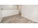 Bright hallway with hardwood floors and white walls at 509 Tallwood Ct, Charlotte, NC 28216