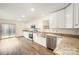 Eat-in kitchen with stainless steel appliances and granite countertops at 509 Tallwood Ct, Charlotte, NC 28216