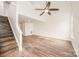 Spacious living room featuring hardwood floors and a ceiling fan at 509 Tallwood Ct, Charlotte, NC 28216