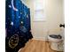 Bathroom with shower/tub combo and a space-themed shower curtain at 535 Grampian Rd, Mt Ulla, NC 28125