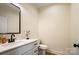 Modern bathroom with white vanity and a black framed mirror at 535 Grampian Rd, Mt Ulla, NC 28125