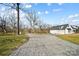 Gravel driveway leading to a white farmhouse at 535 Grampian Rd, Mt Ulla, NC 28125