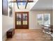 Bright entryway with hardwood floors, exposed beams, and double doors at 535 Grampian Rd, Mt Ulla, NC 28125