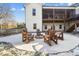 Stone firepit with wooden chairs in snowy yard at 535 Grampian Rd, Mt Ulla, NC 28125