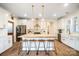 Modern kitchen with white cabinets, butcher block island, and stainless steel appliances at 535 Grampian Rd, Mt Ulla, NC 28125