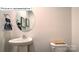 Clean bathroom with pedestal sink and toilet at 548 Zermatt Ct, Monroe, NC 28112