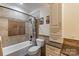 Bathroom with beige tile, granite vanity, and updated fixtures at 6049 Bluebird Hill Ln, Weddington, NC 28104