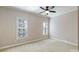 Bright bedroom with neutral walls and carpet flooring at 6049 Bluebird Hill Ln, Weddington, NC 28104