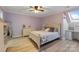 Bright bedroom with a queen-size bed and built-in desk at 6049 Bluebird Hill Ln, Weddington, NC 28104