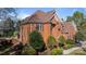 Brick house with brown roof and landscaping at 6049 Bluebird Hill Ln, Weddington, NC 28104