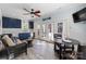 Small, well-equipped kitchenette with dark blue cabinets and a dining table at 6049 Bluebird Hill Ln, Weddington, NC 28104