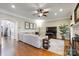 Spacious living room featuring hardwood floors and a large sectional sofa at 6049 Bluebird Hill Ln, Weddington, NC 28104